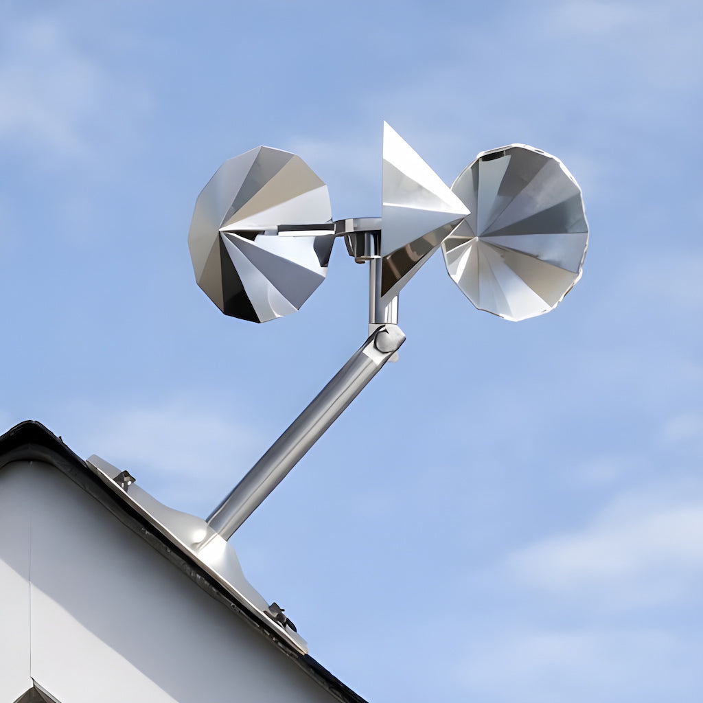 Ecobarbet™ Bird Deterrent Spinner mounted on a roof peak. The ultimate bird reflector for roofs, featuring an adjustable pole and silver chrome cups.