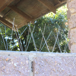 Stainless steel bird spike on brick wall