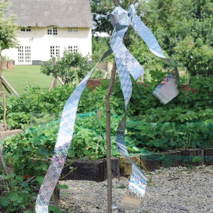 Use bird scare tape in vegetable gardens to get rid of birds